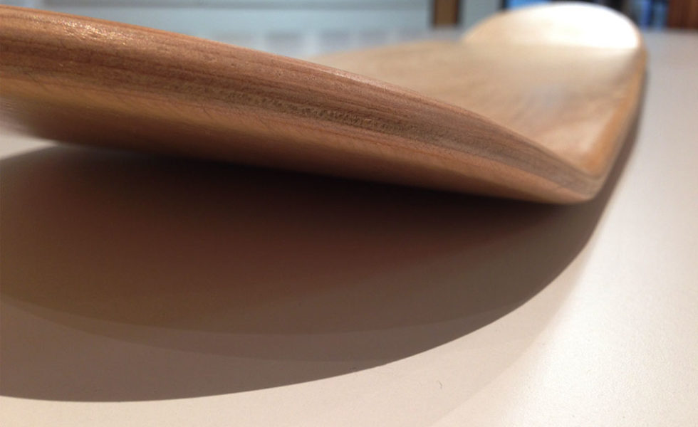 Close-up of wooden skateboard deck edge